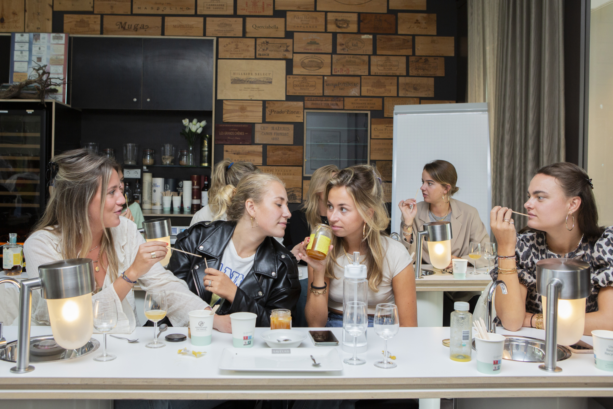 Students in the wine room during a honey tasting
