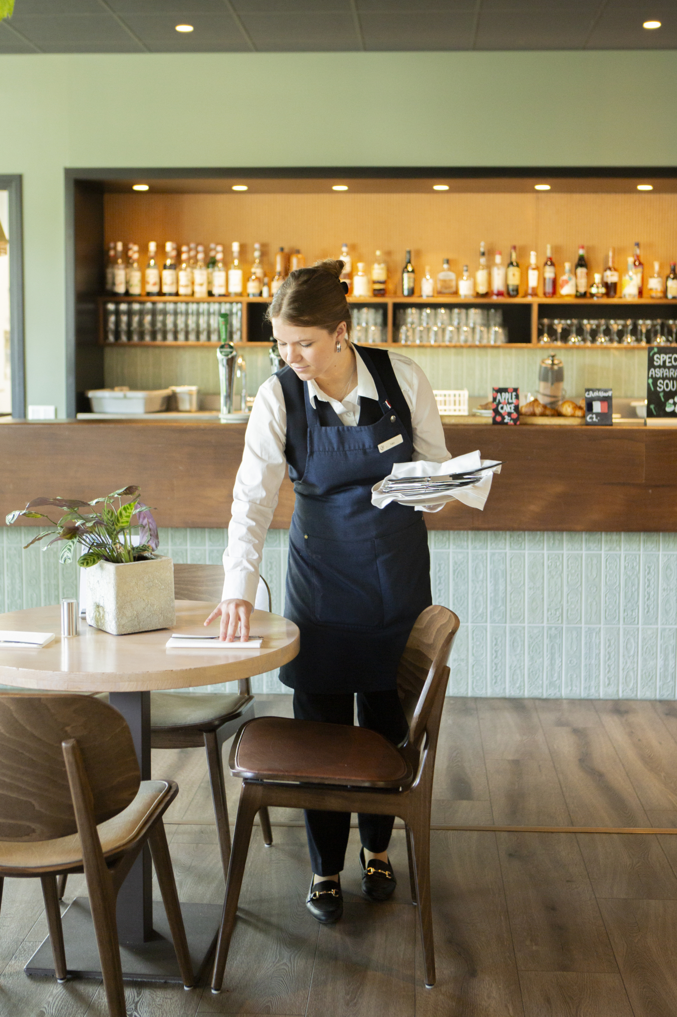 Student setting up the table
