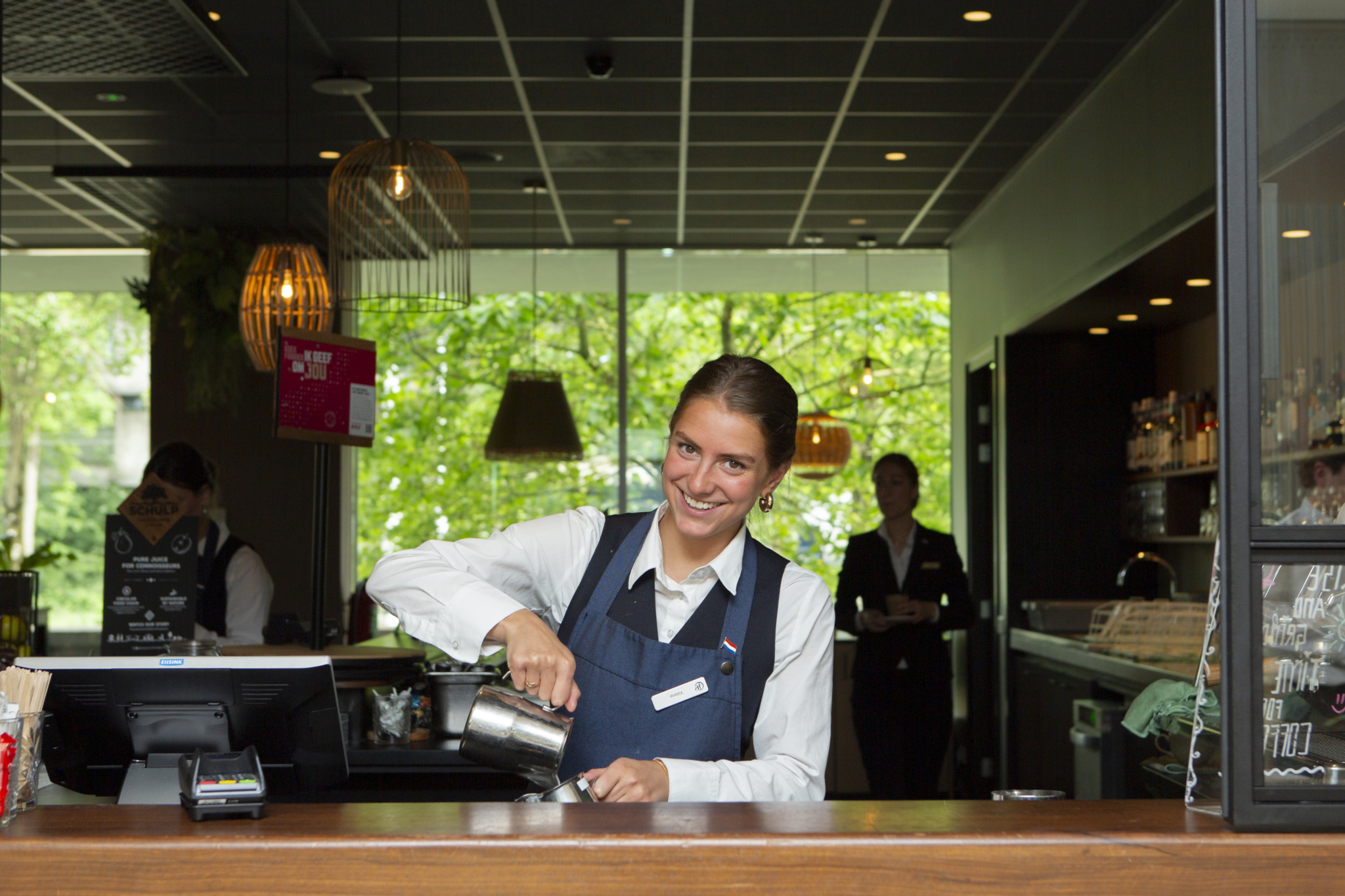 Student serving coffee